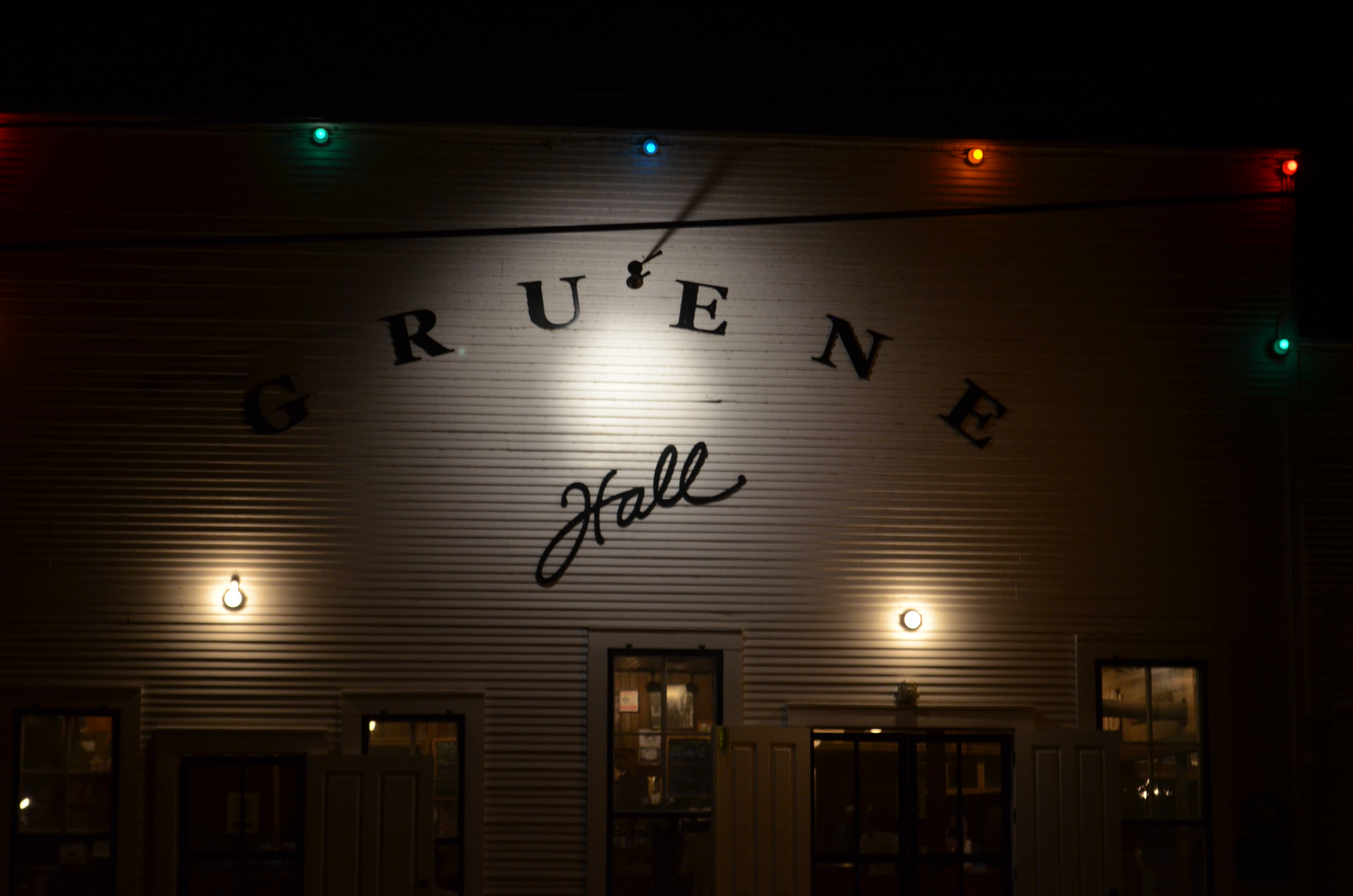 Historic Gruene Hall lit up at night.